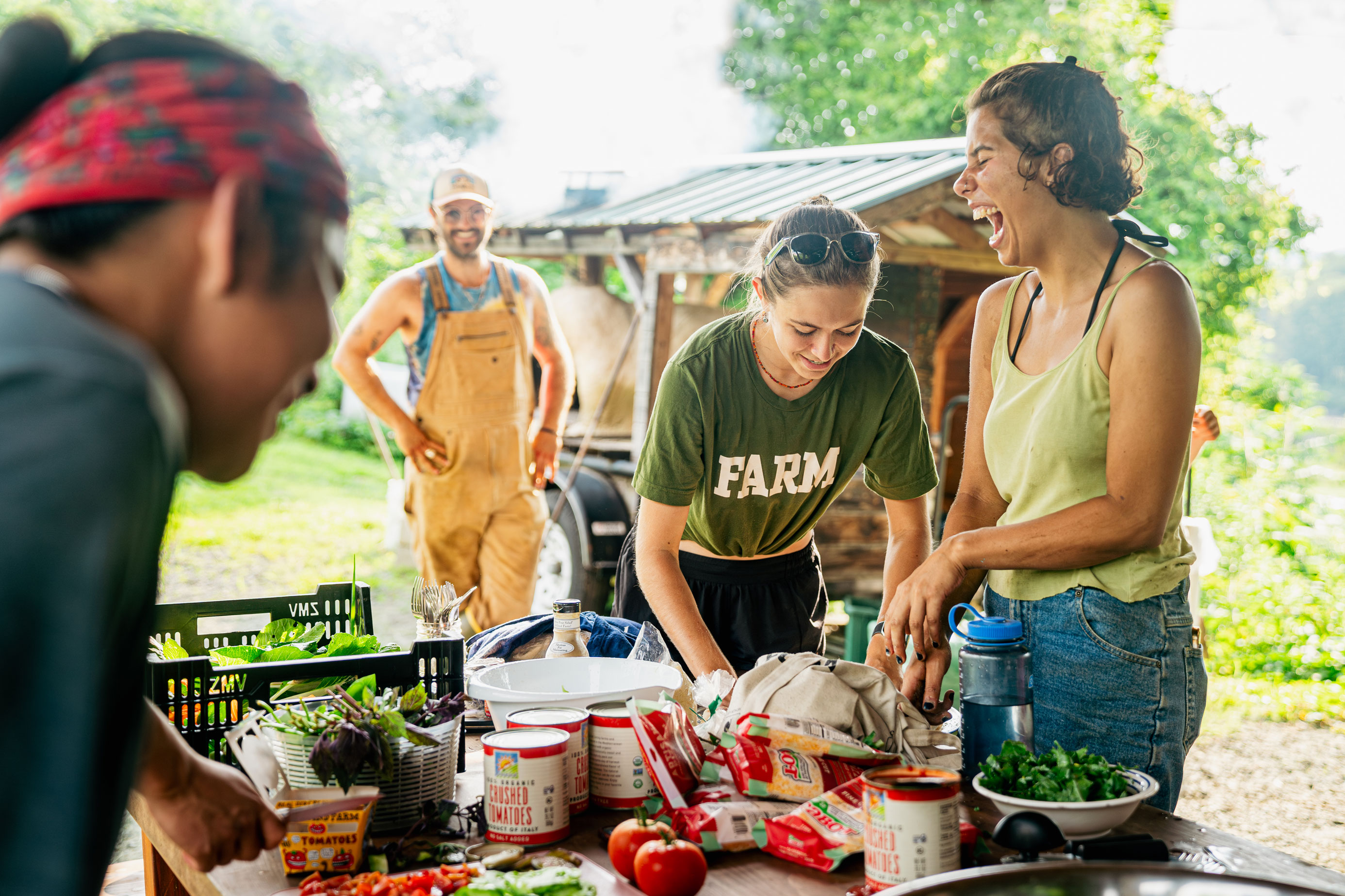 Dartmouth students laughing while enjoying pizza dinner